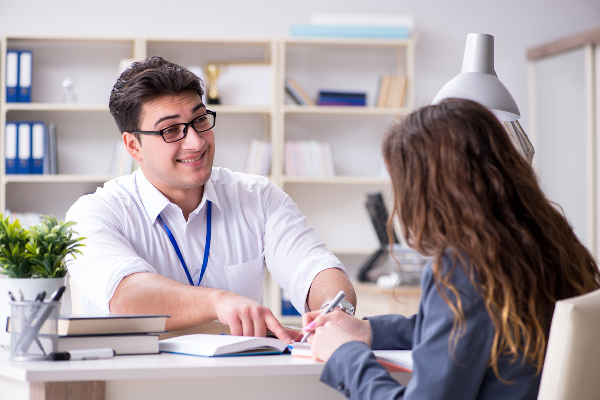 Sales Assistant Discussing Transaction with Customer